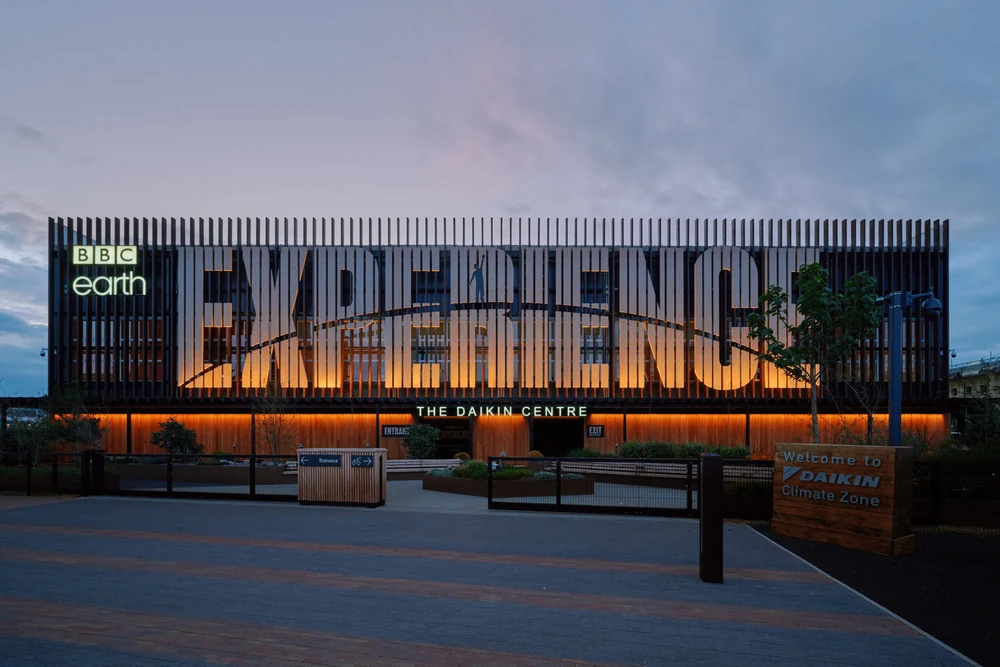 BBC Earth Experience at Earl’s Court, with its illuminated entrance and timber-screened facade