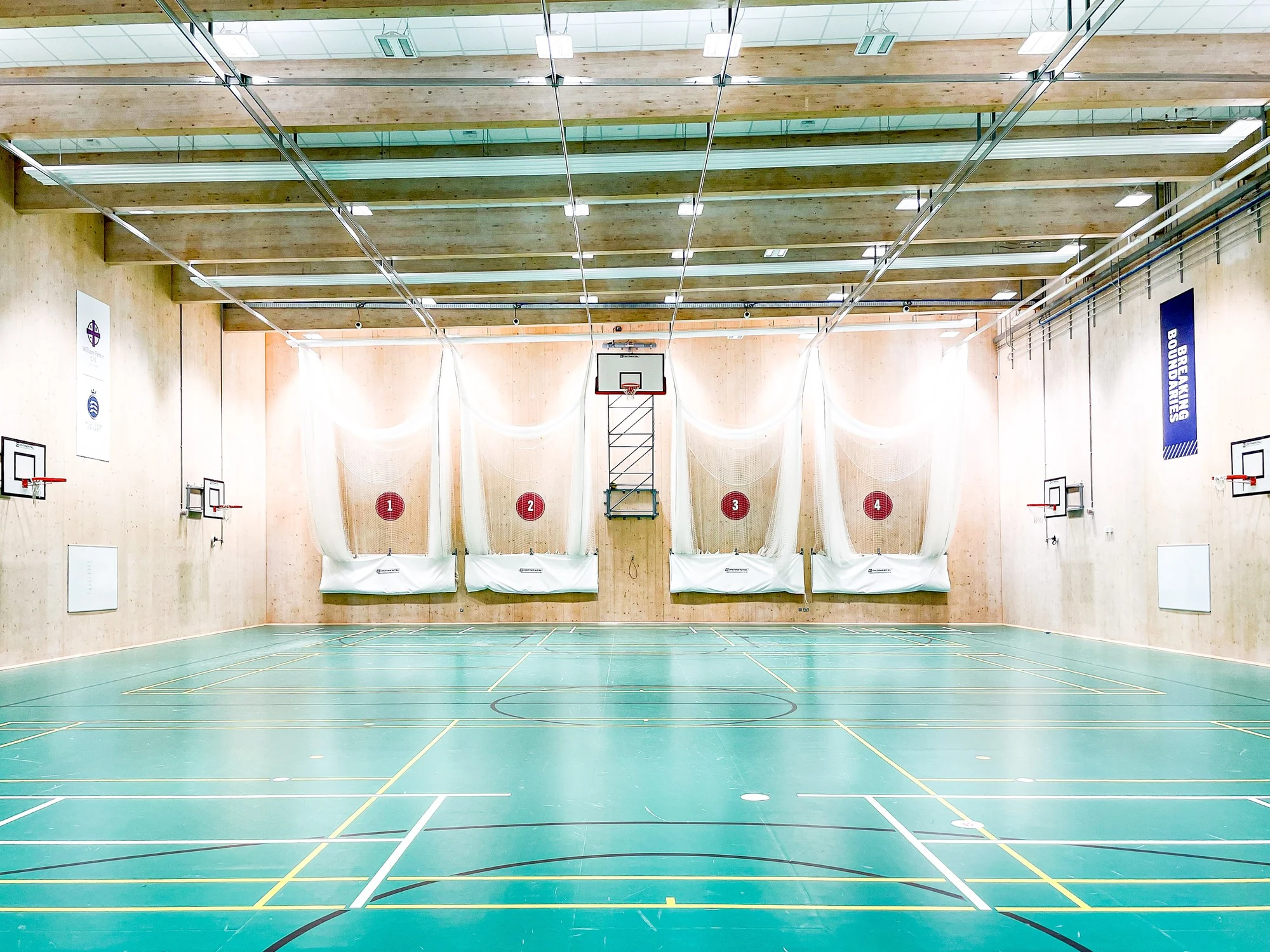 The Wilf Slack Cricket Centre at William Perkin School, with four practice lanes and retained multi-sport court markings